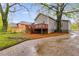 Backyard features a wooden deck, concrete driveway and lush lawn at 926 Welch Sw St, Atlanta, GA 30310