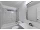 Bathroom with marble tiling, shower over tub and modern vanity at 926 Welch Sw St, Atlanta, GA 30310