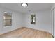 Bright bedroom with hardwood floors, two windows, and closet space at 926 Welch Sw St, Atlanta, GA 30310