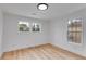 Sun-filled bedroom with beautiful floors and well-lit by two large windows at 926 Welch Sw St, Atlanta, GA 30310