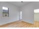 Well lit bedroom features hardwood floors, closet, and nearby doorway at 926 Welch Sw St, Atlanta, GA 30310