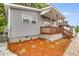 Attractive home with a wood porch, manicured flower beds, and gray siding at 926 Welch Sw St, Atlanta, GA 30310