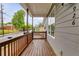 Spacious front porch with wooden railings and a clear view of the street at 926 Welch Sw St, Atlanta, GA 30310
