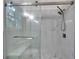 Large shower with marble tiling and bench at 926 Welch Sw St, Atlanta, GA 30310