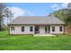 A view of the backyard, siding, windows and grass at 1195 Awenasa Dr, Villa Rica, GA 30180
