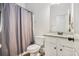 Bathroom with shower and tub, granite countertops, and white vanity at 1195 Awenasa Dr, Villa Rica, GA 30180