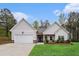 Charming single-story home with a two-car garage, well-manicured lawn, and fresh landscaping at 1195 Awenasa Dr, Villa Rica, GA 30180