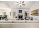 Cozy living room with a fireplace, stylish seating, and an open view to the dining area at 1195 Awenasa Dr, Villa Rica, GA 30180
