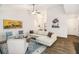 Bright and airy living room featuring modern furniture, hardwood floors and stylish decor at 1195 Awenasa Dr, Villa Rica, GA 30180