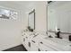 Modern bathroom featuring dual sinks, quartz countertops, and sleek black fixtures at 3214 Cedar Bluff Ne Dr, Marietta, GA 30062