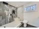 Contemporary bathroom showcasing a large walk-in shower with grey tile and a modern toilet at 3214 Cedar Bluff Ne Dr, Marietta, GA 30062