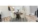 Bright dining area complemented by wood floors, natural light, neutral colors and elegant decor for comfortable gatherings at 3214 Cedar Bluff Ne Dr, Marietta, GA 30062