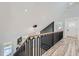 The bright interior showcases a modern railing and wood floors leading to the front door and a stylish light fixture at 3214 Cedar Bluff Ne Dr, Marietta, GA 30062