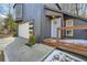 Beautiful covered porch, and stylish garage door, enhance this home's appeal with its inviting entryway and modern accents at 3214 Cedar Bluff Ne Dr, Marietta, GA 30062