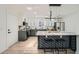 Modern kitchen with gray and white cabinets, quartz countertops, stainless appliances, and a large central island at 3214 Cedar Bluff Ne Dr, Marietta, GA 30062