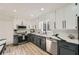 Stylish kitchen featuring white cabinets, dark countertops, modern stainless steel appliances and lots of storage space at 3214 Cedar Bluff Ne Dr, Marietta, GA 30062