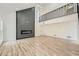 Spacious living room featuring fireplace and wood floors with natural light at 3214 Cedar Bluff Ne Dr, Marietta, GA 30062