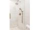 Bright shower with frameless glass, white tile and brass fixtures in updated bathroom at 383 6Th Ne St # 4, Atlanta, GA 30308