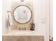 Bathroom features a unique sink with a round mirror and neutral countertop at 383 6Th Ne St # 4, Atlanta, GA 30308