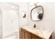 Updated bathroom features a marble countertop, white tile and a glass enclosed shower at 383 6Th Ne St # 4, Atlanta, GA 30308