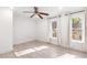 Spacious bedroom featuring a ceiling fan, recessed lighting, two windows and light wood floors at 383 6Th Ne St # 4, Atlanta, GA 30308