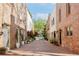 Charming brick townhouse featuring well-maintained landscaping and a paver driveway at 383 6Th Ne St # 4, Atlanta, GA 30308