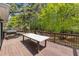 Spacious outdoor deck perfect for entertaining or relaxing with a BBQ grill and patio furniture at 3898 Hadley Farm Dr, Marietta, GA 30066