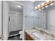 Bathroom featuring a vanity with granite countertop and a shower with white tiled walls at 3898 Hadley Farm Dr, Marietta, GA 30066