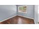 Bedroom featuring hardwood floors and a bright window at 3898 Hadley Farm Dr, Marietta, GA 30066