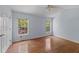 Bedroom featuring hardwood floors, two windows, and a ceiling fan at 3898 Hadley Farm Dr, Marietta, GA 30066