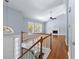 Bright foyer with hardwood floors, staircase, and a view into the living room with fireplace at 3898 Hadley Farm Dr, Marietta, GA 30066