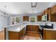 Kitchen with stainless steel appliances, breakfast bar and ample cabinet space, next to the dining area at 3898 Hadley Farm Dr, Marietta, GA 30066