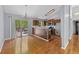 Eat-in kitchen with stainless steel appliances, breakfast bar, wooden cabinets, and access to the deck at 3898 Hadley Farm Dr, Marietta, GA 30066