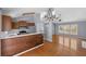 Open concept view of the kitchen and living room area, featuring hardwood floors and stainless steel appliances at 3898 Hadley Farm Dr, Marietta, GA 30066