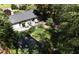 Aerial view of backyard showcasing the deck, manicured lawn, garden shed, and mature landscaping at 4519 Sims Ct, Tucker, GA 30084