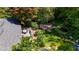 Aerial view of backyard showcasing the deck, manicured lawn, garden shed, and mature landscaping at 4519 Sims Ct, Tucker, GA 30084