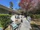 Back yard featuring wooden deck, mature landscaping, and patio furniture at 4519 Sims Ct, Tucker, GA 30084