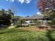Expansive backyard featuring a wooden deck, lounge chairs, and lush greenery for outdoor enjoyment at 4519 Sims Ct, Tucker, GA 30084