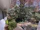 Picturesque backyard featuring mature trees, lush greenery, stone pavers, and an attached deck at 4519 Sims Ct, Tucker, GA 30084