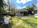Spacious backyard with a storage shed, featuring lush lawn and seating for outdoor relaxation at 4519 Sims Ct, Tucker, GA 30084