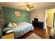 Comfortable bedroom features hardwood floors, and soft natural light at 4519 Sims Ct, Tucker, GA 30084