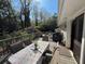 Outdoor deck with table, chairs, and a view of the backyard at 4519 Sims Ct, Tucker, GA 30084