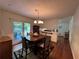 Dining room offers a view to the backyard and hardwood floors, perfect for entertaining at 4519 Sims Ct, Tucker, GA 30084