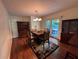 Formal dining room boasts hardwood floors, elegant furniture, and natural light at 4519 Sims Ct, Tucker, GA 30084