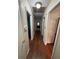 Inviting hallway features neutral paint, hardwood floors, and access to rooms at 4519 Sims Ct, Tucker, GA 30084