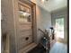 Hallway showing grey brick siding and access to the backyard at 4519 Sims Ct, Tucker, GA 30084