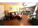Cozy living room featuring hardwood floors, neutral walls, fireplace, and classic furniture at 4519 Sims Ct, Tucker, GA 30084