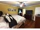 Comfortable main bedroom with hardwood floors and natural light at 4519 Sims Ct, Tucker, GA 30084