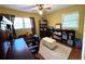 Bright office space with hardwood floors, a large window, and built-in bookshelves at 4519 Sims Ct, Tucker, GA 30084