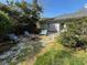Cozy backyard patio with comfortable seating, a fire pit, and lush landscaping for relaxing outdoors at 4519 Sims Ct, Tucker, GA 30084